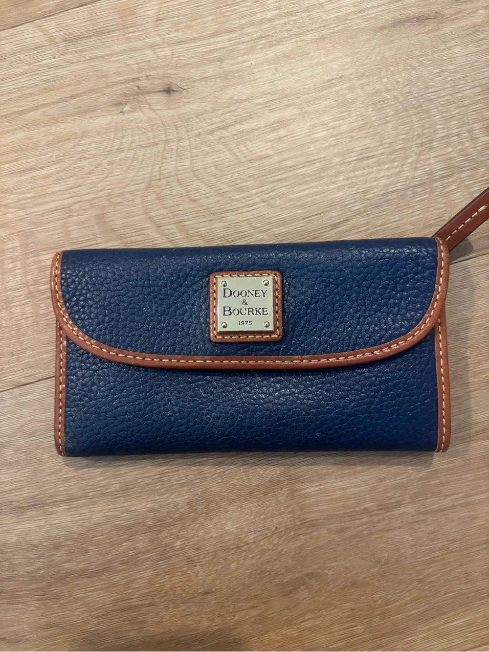 Dooney & Bourke Navy Pebbled Leather Wallet with Tan Trim and Wrist Strap